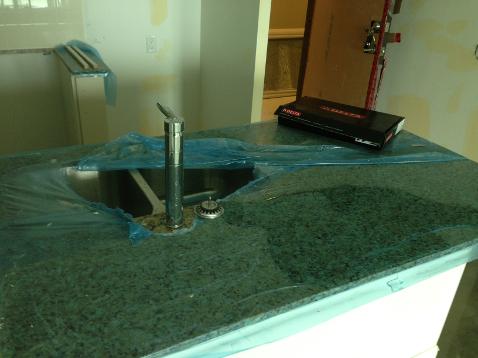 plumber in innisfil, new kitchen faucet instal in innisfil, granite countertop, delta kitchen faucet, 